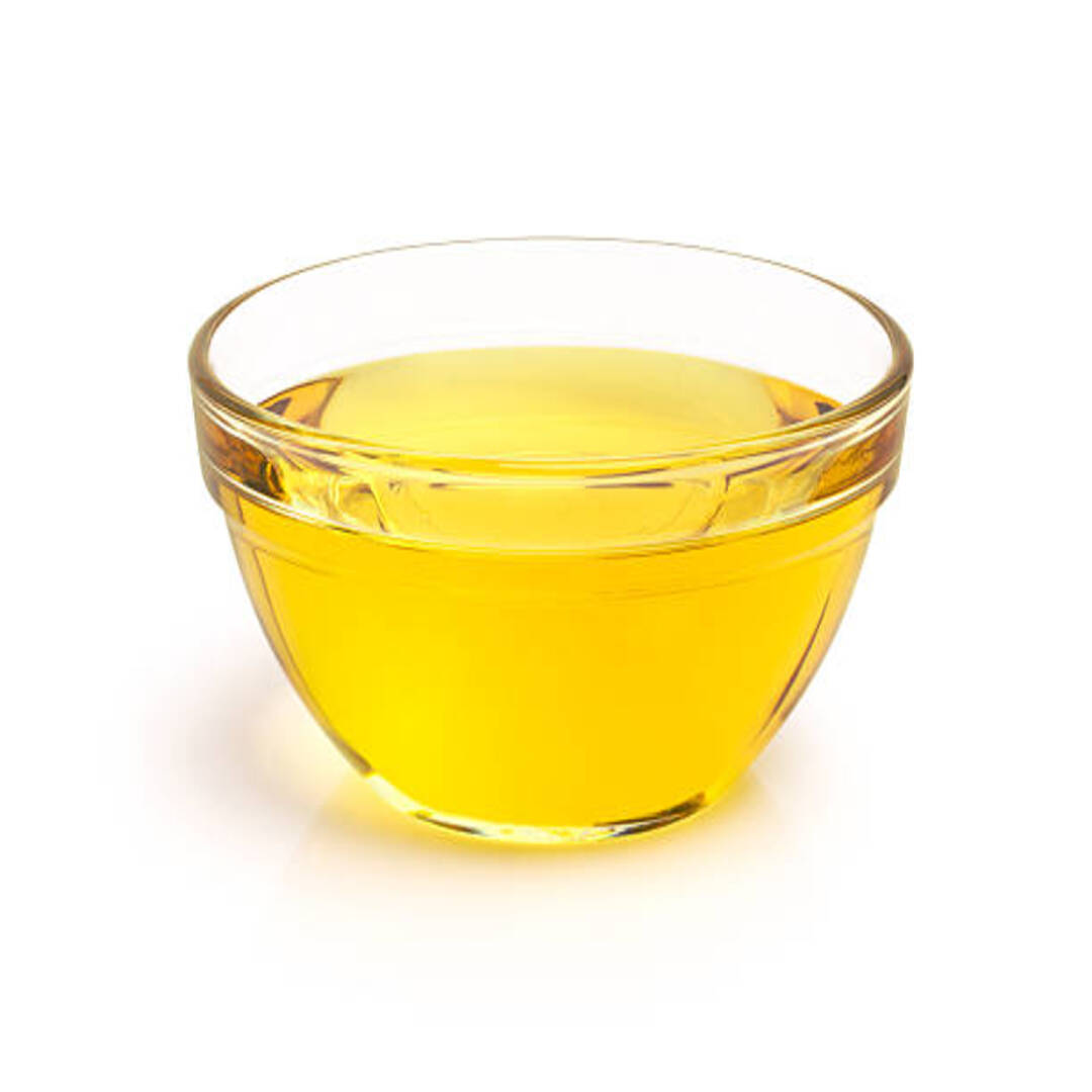 Cooking oil in a glass bowl on white background